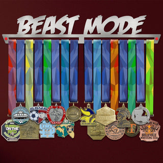 Beast Mode Medal Hanger holding a full row of medals on a wall