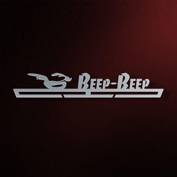 Beep Beep Running Medal Hanger in laser-cut steel on a dark background