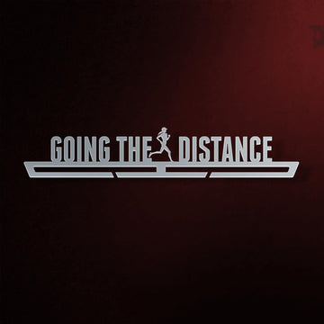 Women's Going The Distance Medal Hanger in laser-cut steel on a dark background
