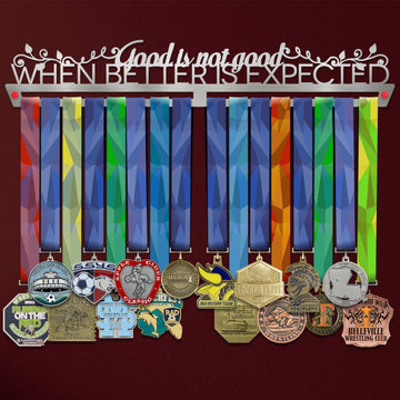 Good Is Not Good Medal Hanger holding a full row of medals on a wall