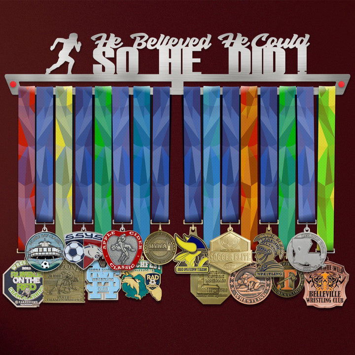 He Believed He Could So He Did Medal Hanger holding a full row of medals on a wall