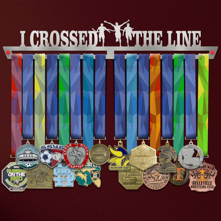 I Crossed The Line Medal Hanger holding a full row of medals on a wall