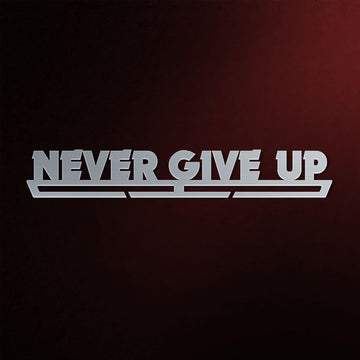 Never Give Up Medal Hanger in laser-cut steel on a dark background