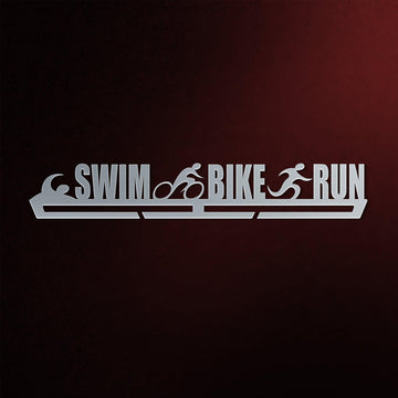 Swim Bike Run Medal Hanger in laser-cut steel on a dark background